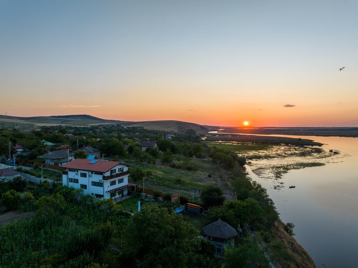 Aerial view of Laguna Nuferilor guesthouse and the edge of the Danube Delta in Somova